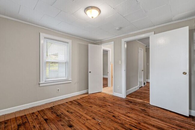 Building Photo - Adorable Home, Just Painted, Wood Flooring...