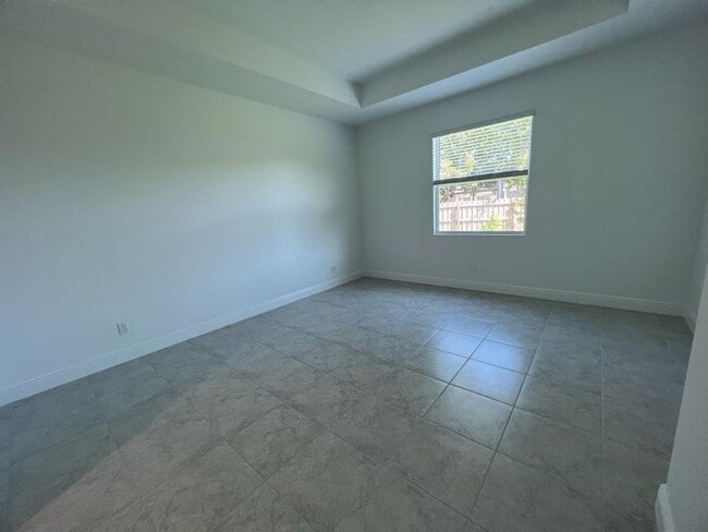 Building Photo - This Charming Brand-New Home is a 4/3 with...