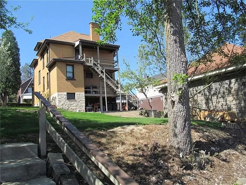 Photo from back parking pad. Yard is now fenced but you can see private back porch - 729 Gallion Ave