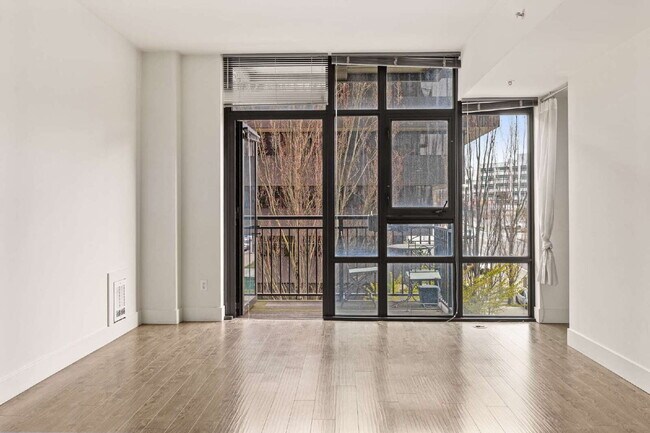 Building Photo - Open 2bdrm 1 bath with floor to ceiling windows!