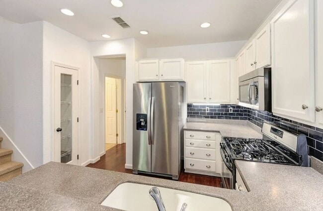 Building Photo - Experience Esplanade! Premier Townhome Com...