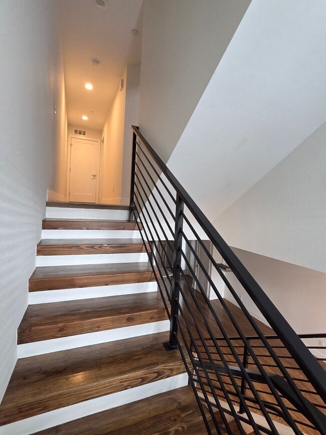 Building Photo - STUNNING 4-LEVEL TOWNHOME IN HIGHLANDS WITH SAUNA, 2-CAR GARAGE + AMAZING ROOFTOP DECK!