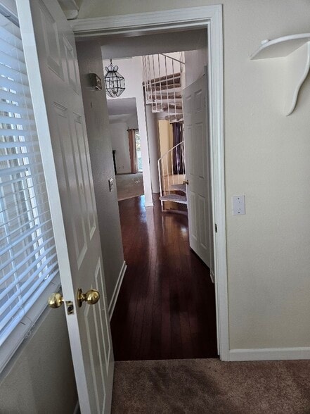 from hall bedroom to bath, entry, spiral stairway - 7532 Seaspring Dr