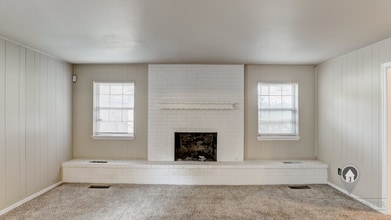 Building Photo - 4 Bedroom,2.5 Bath and 2 Car Garage Duplex with Fireplace and Prime Location Near Lake Hefner