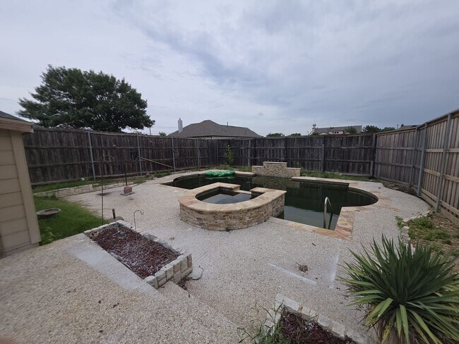 Building Photo - Spacious 4-Bedroom Home with Pool & Spa in...