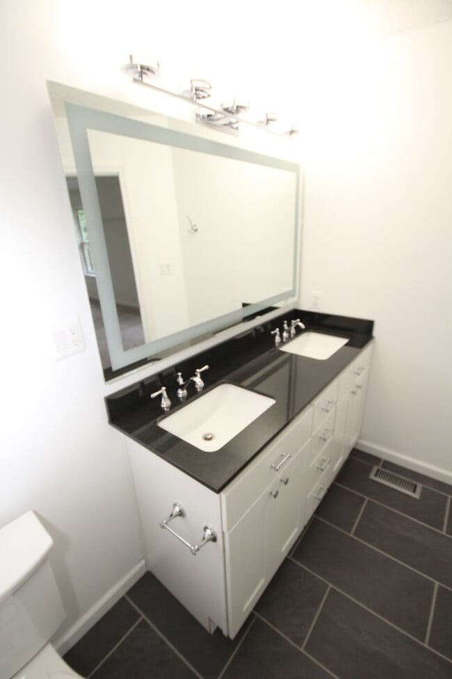 Building Photo - *Coming Soon*  Upgraded End Unit Townhome ...