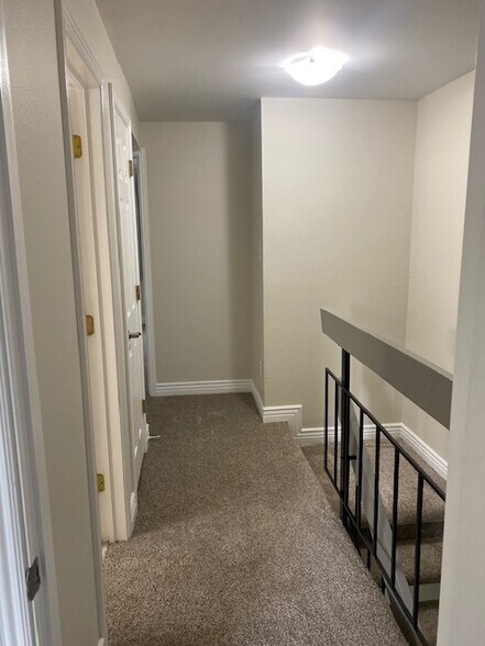 2nd floor hallway from master bedroom. Hallway bathroom on left. - 411 E Highline Cir