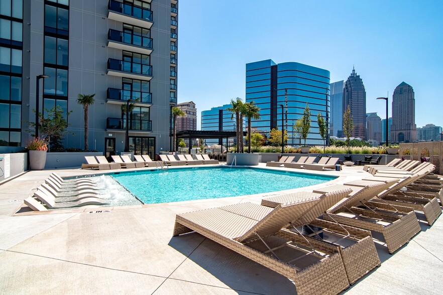 Luxe pool with chaise lounges and cabanas. - Ascent Midtown