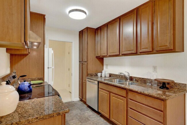 Building Photo - Modern 2-Bedroom Condo with Pool and Koi Pond Views