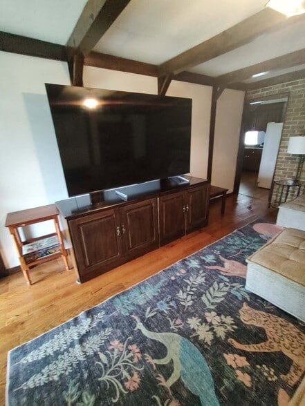 Spacious living room with modular couch and 90" 4k 120hz TV - 15493 Siesta Ave