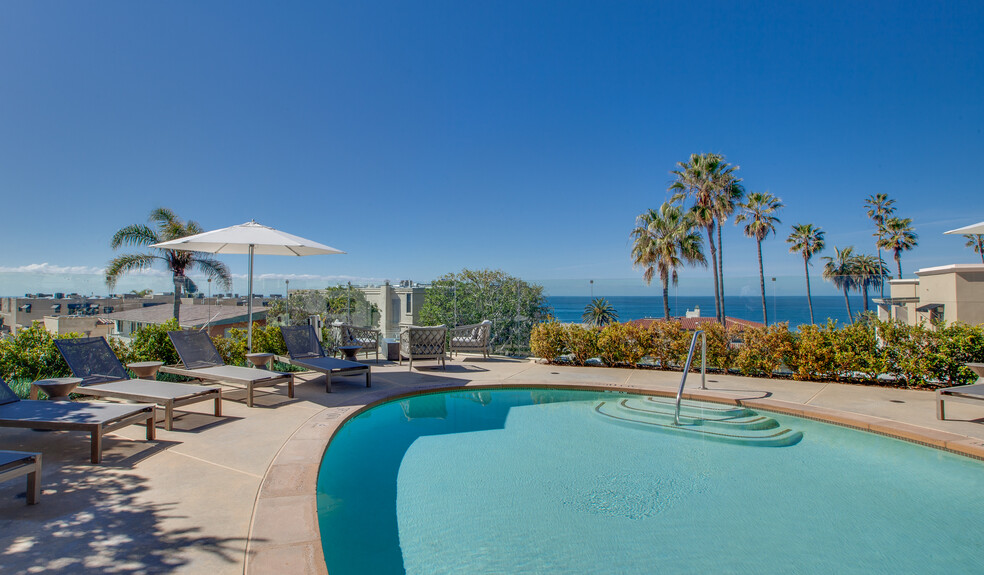 Take in the amazing ocean views while hanging out by the pool - Ocean House on Prospect Apartment Homes