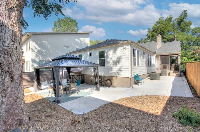 Building Photo - Discover the charm of this FULLY FURNISHED basement unit, tucked away in a beautifully updated bu...