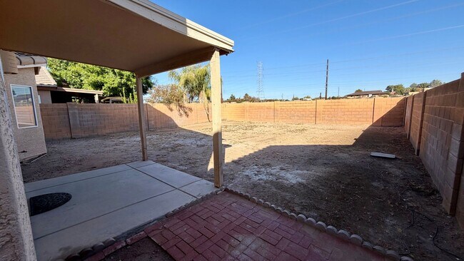 Building Photo - Two Story Home with NEW tile and a large backyard!