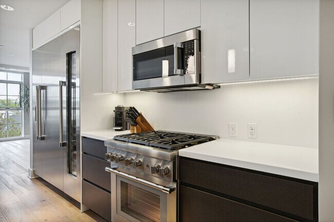 Building Photo - Elegant 2BR at The Adora | 1,500+ SF, Chef’s Kitchen & Garage Parking!