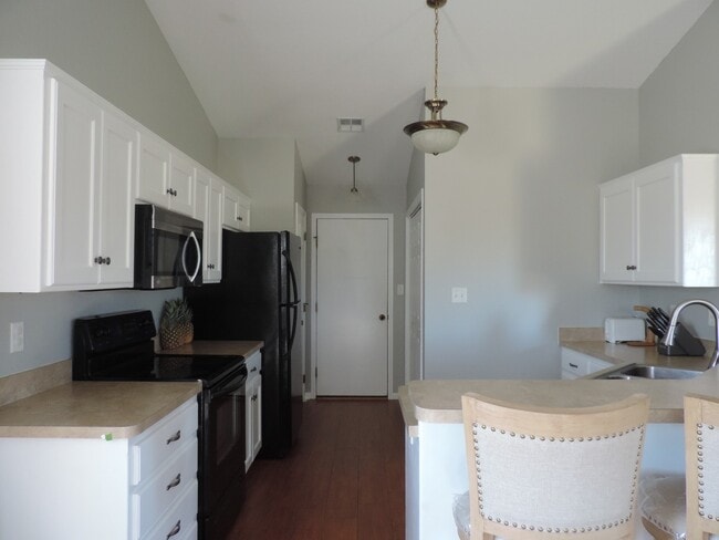 Building Photo - UPDATED KITCHEN! NEW PAINT! FENCED BACKYARD!