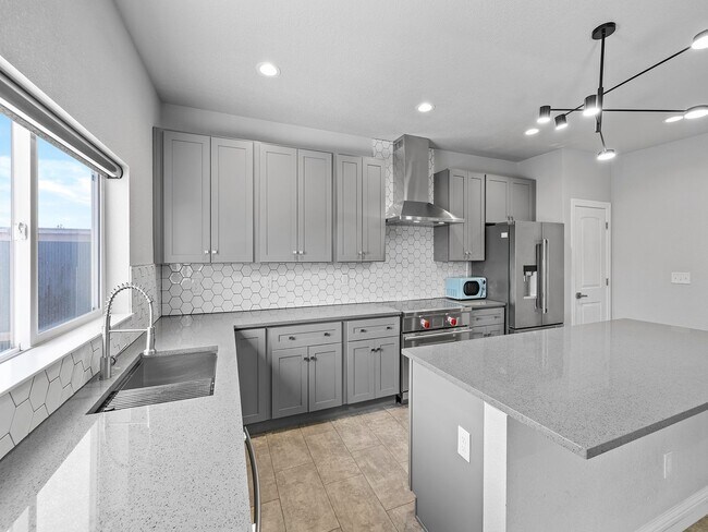 Building Photo - 4-Bedroom Townhome with Finished Basement, Garage & Private Outdoor Space