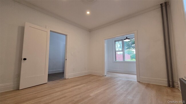 Building Photo - 42-21 65th Pl