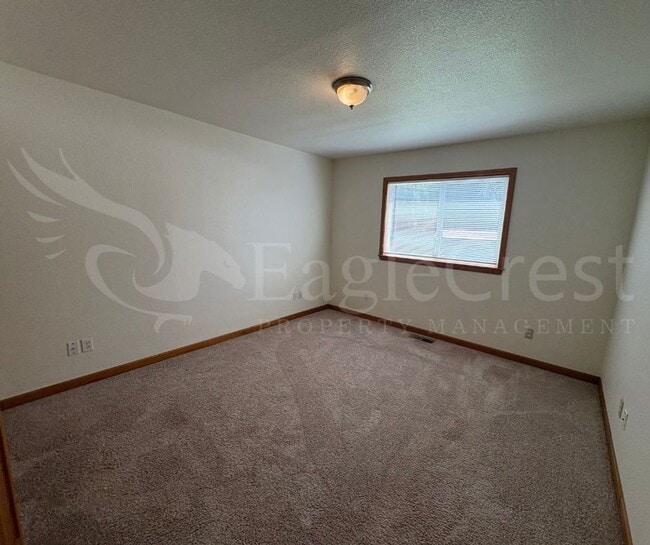 Building Photo - Three Bedroom, Two Bathroom House with Fenced Yard and Outdoor Fireplace