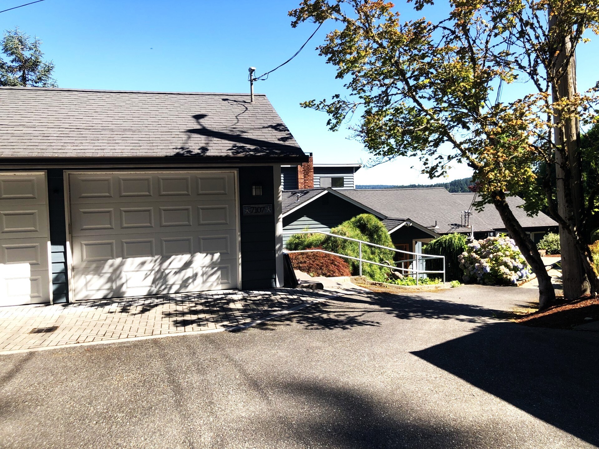 House set down from the garage with both steps & ramp to front door - 7107 120th St NW