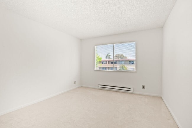 Building Photo - Modern 2-Bedroom Condo with Pool and Koi Pond Views