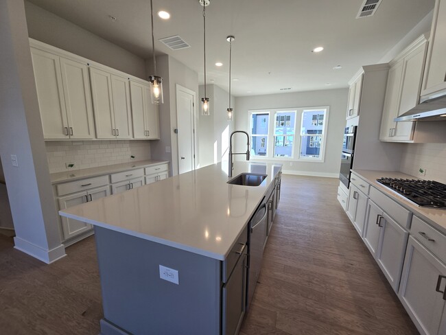 open kitchen with island - 2449 Red Maple Xing