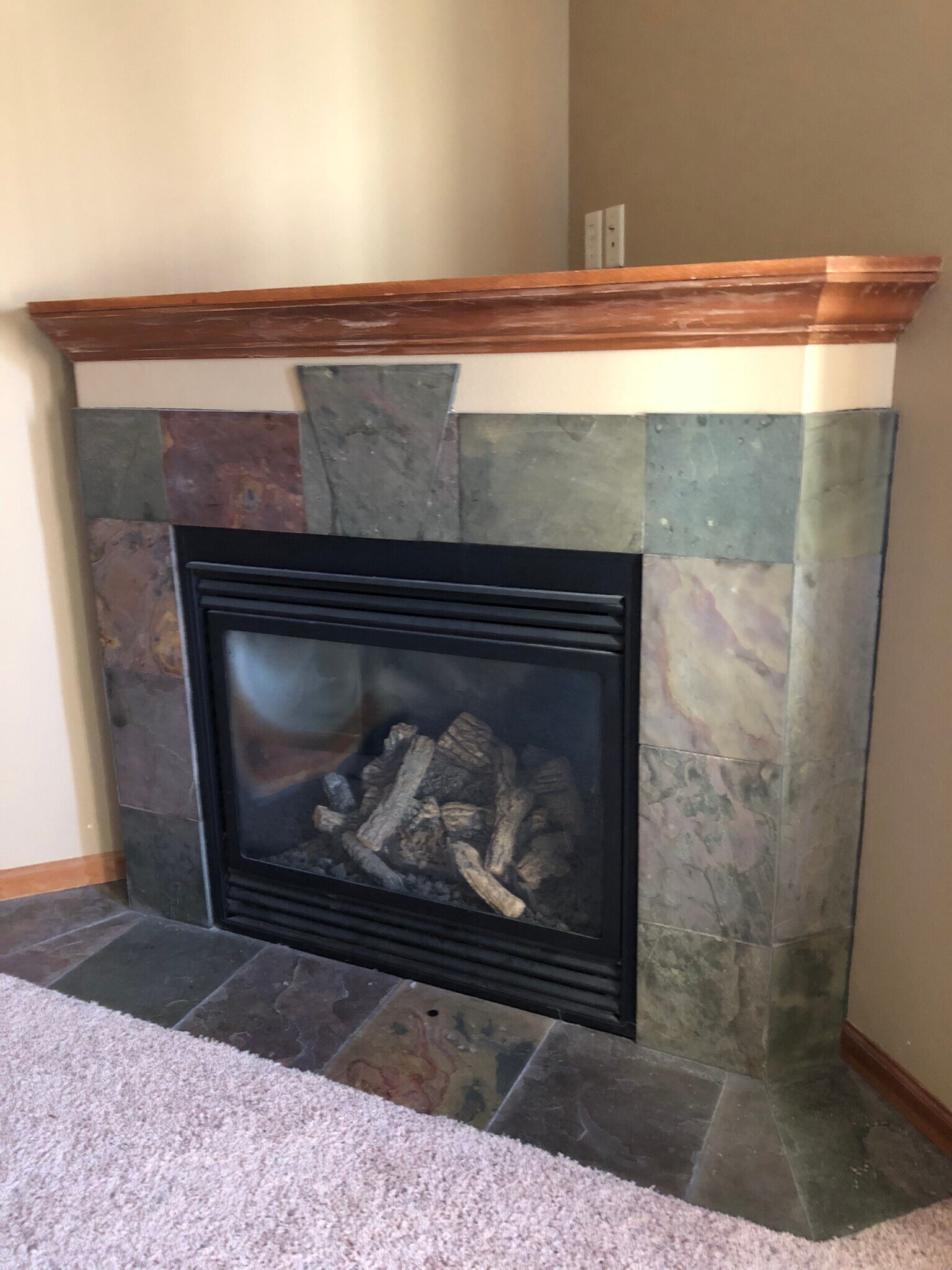 Lower level family room has a fireplace. - 911 N Bahnson Ave