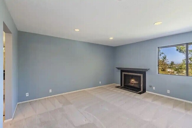 Building Photo - Upgraded La Costa Townhome