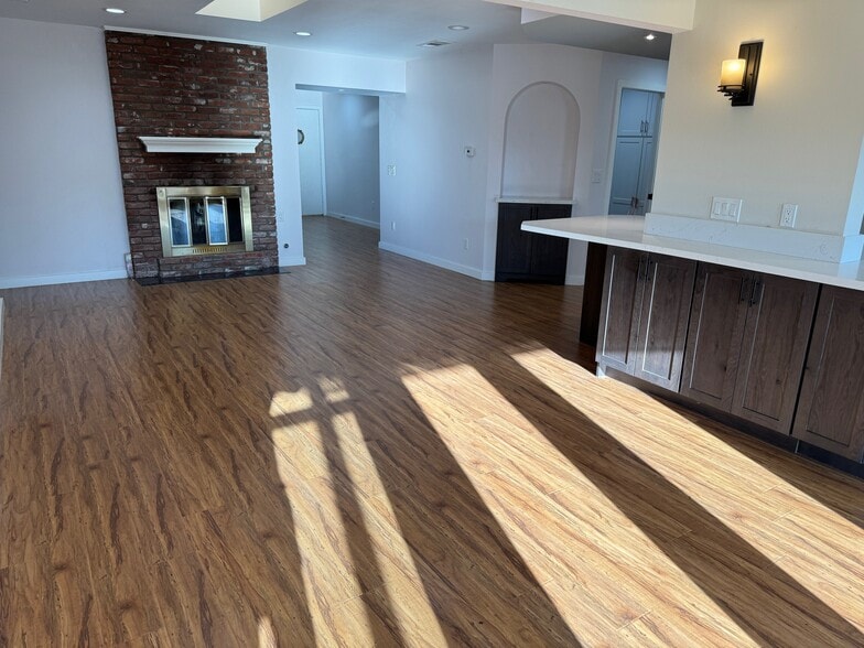 Double sided fire place in dining room & living room. - 22471 Loch Lomond Dr