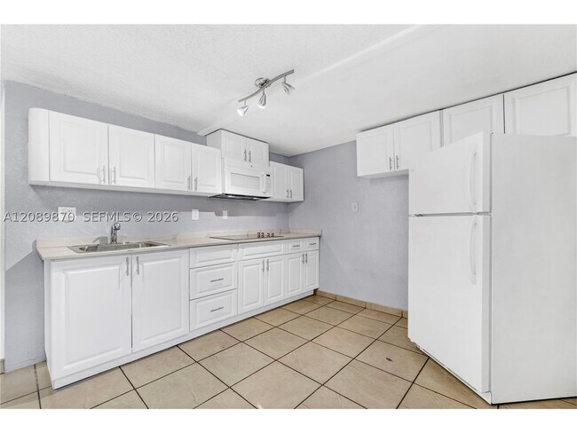 Building Photo - 6049 W 14th Ln