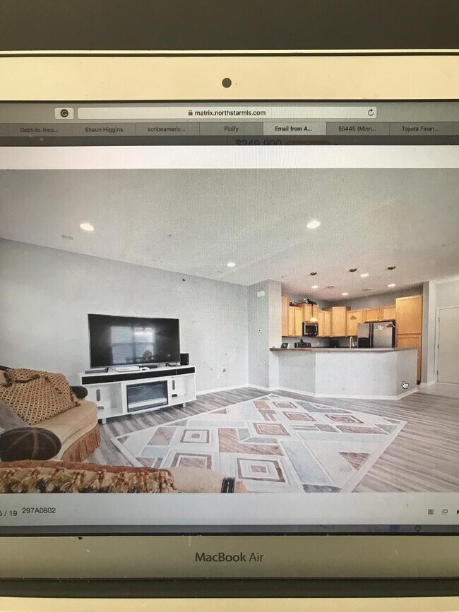 Sitting room with kitchen view - 9610 Scott Cir N