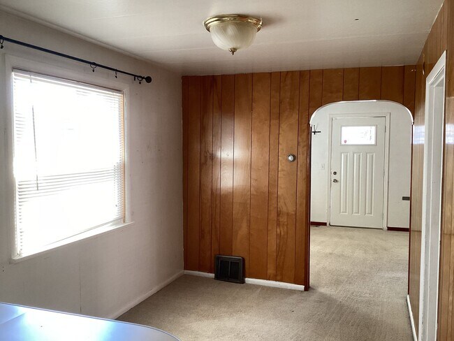 Building Photo - Charming 2BR Home with Spacious Yard, Detached Garage & Garden Oasis