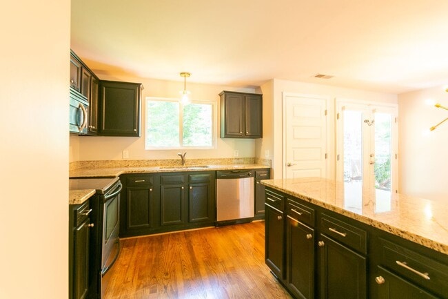 Building Photo - **Application pending 5/1/2026**Stunning Carrboro Condo available early June!