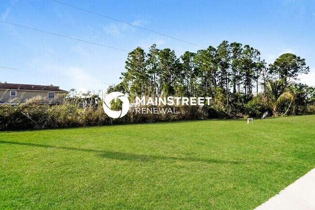 Building Photo - 4 Bedroom Pet-Friendly Home in LEHIGH ACRES, FL with Main Street Renewal