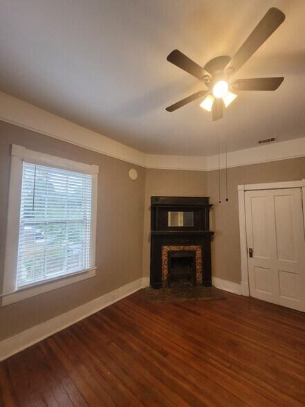 Back Parlor/Living Room with decorative fireplace, original hardwood floors, Levolor blinds, & ceili - 1217 Java Pl