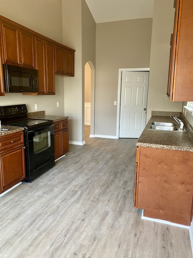 Kitchen. Yes, a fridge is included - 105 Burr Dr