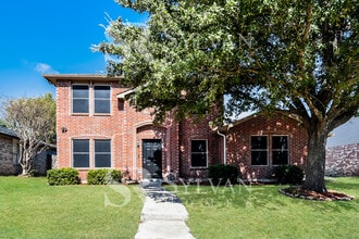 Building Photo - The living is easy in this gorgeous 4BR, 2.5BA brick home
