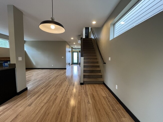 Building Photo - Charming 3 Bedroom, 2.5 Bathroom Home with Large Living Room, Tall Windows, Island Kitchen, and A...