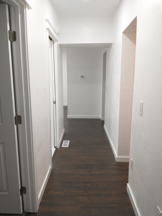 Hallway to bedrooms, bathroom, laundry room - 306 S. 2nd. St.