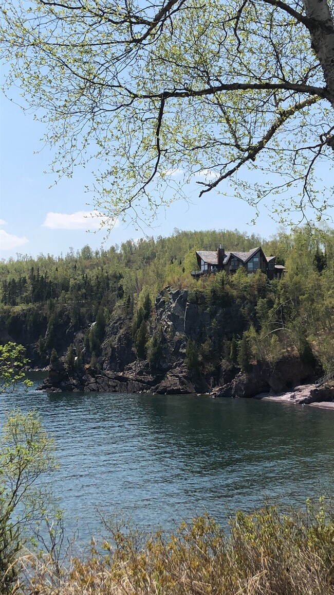 The private beach (right) and land below the cabin (located behind the home shown here) - 6012 Highway 61