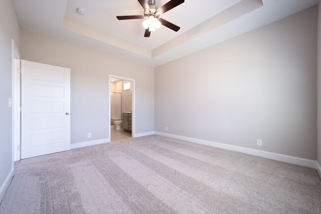 Building Photo - Elegant Home with Stone Fireplace, Kitchen Island and Designer Primary Suite