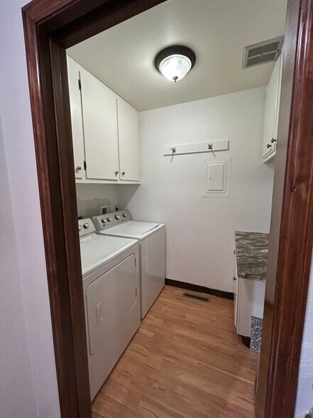 Separate utility room with washer and dryer and extra storage - 435 E Drake Rd