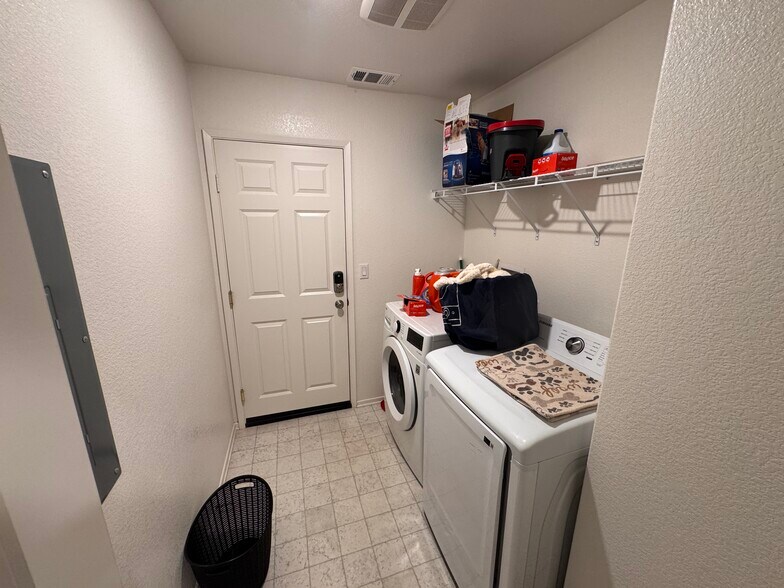 Laundry room and garage man door - 15659 Whispering Creek Way