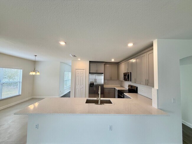 Building Photo - GORGEOUS, Large Completely Renovated Two-Story 4/2.5 PLUS LOFT in POINCIANA VILLAGES!