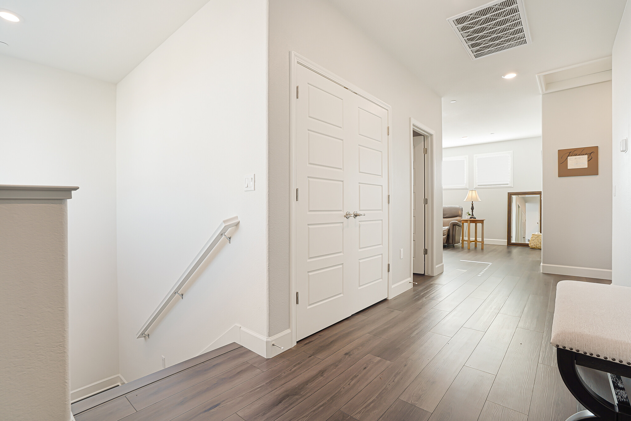 Large upstairs hallway leading to media room. - 5919 Lakestone Dr