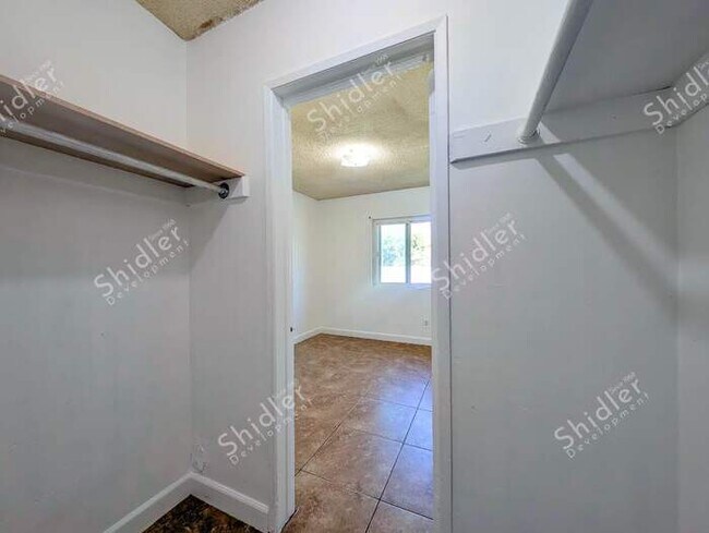 Building Photo - Upstairs 2 Bedroom 1 Bath with Massive Walk In Closet, Covered Gated Parking
