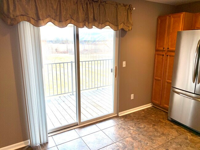 Kitchen window and walkout to a deck - 51870 Adler Park Dr E