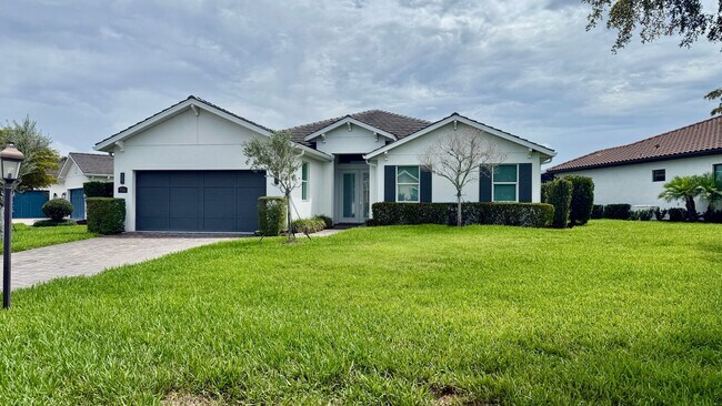 Building Photo - Rare Lakefront Pool Home in Exclusive Gated Sandhill Lake – Resort-Style Living Awaits