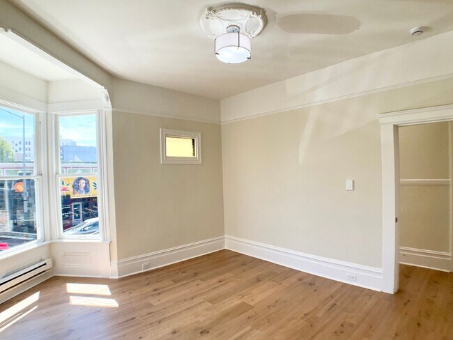 Building Photo - LOWERED PRICE! FULL FLOOR FLAT! Bay Window...