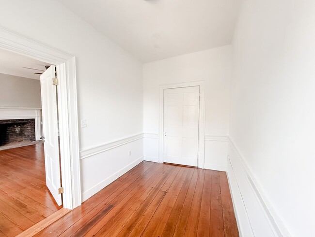 Building Photo - Renovated One-Bedroom Gem Steps from Train...