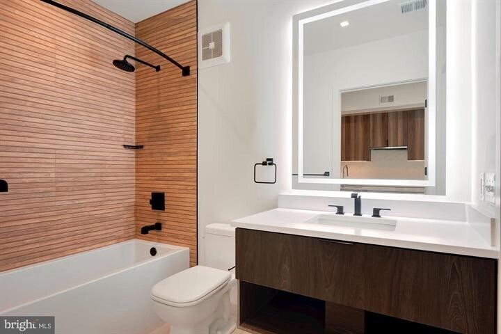 Large bath with lighted mirror. - 801 N St NW